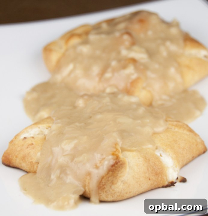 Savory Chicken Crescent Bites 2 Golden brown Chicken Stuffed Crescent Rolls fresh from the oven, showcasing their flaky crust and savory chicken filling - an easy weeknight meal that kids will love.