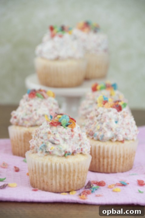 Fruity Pebble Fantasy Vanilla Cupcakes 3 A simple vanilla cupcake recipe topped with colorful Fruity Pebbles Buttercream Frosting, ideal for St. Patrick's Day or any festive occasion. These cupcakes are perfectly sweet and kid-friendly.