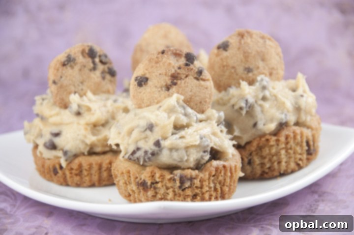 Double Cookie Bliss Cups 3 Soft, chewy ultimate chocolate dessert cookie cup recipe: thick Chocolate Chip Cookie Cups with Cookie Dough Frosting baked in a cupcake tin with rich, egg-free chocolate chip cookie dough mounded on top.