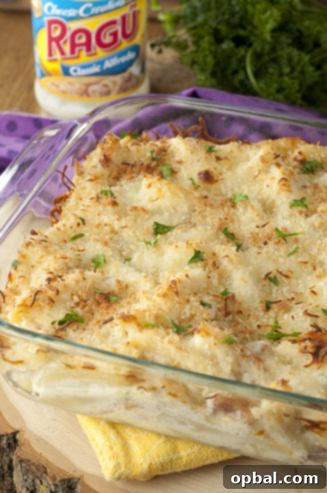 Close-up of creamy baked Bacon Alfredo Pasta dish, showcasing its cheesy texture and rich Alfredo sauce, a classic Italian comfort food.