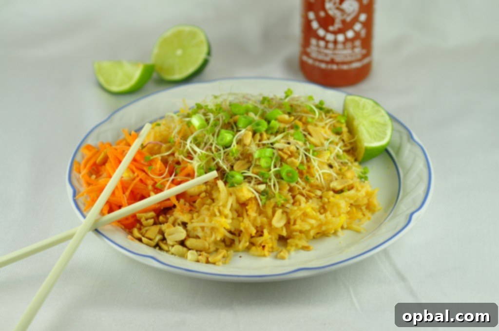Chicken Pad Thai Delicious Chicken Pad Thai noodles garnished with lime, peanuts, and cilantro