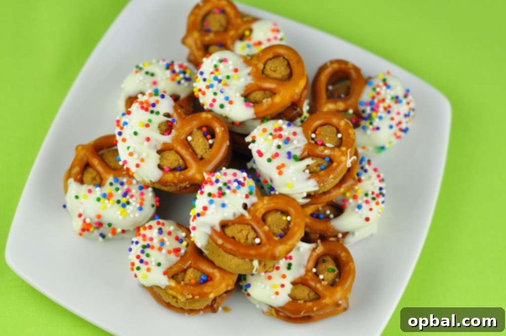 White Chocolate Biscoff Pretzel Bites Close-up of freshly made White Chocolate Biscoff Pretzel Bites on a baking sheet, ready to be served.