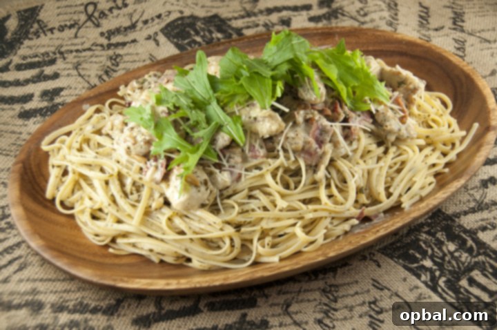 Signature Bellagio Chicken 2 Chicken Bellagio dinner recipe is a copy-cat of the popular Cheesecake Factory chicken and pasta dish with crispy, juicy pan-fried chicken, spaghetti coated in a creamy Parmesan pesto cream sauce and topped with prosciutto and arugula!