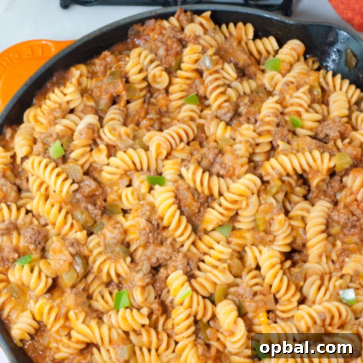Loaded Sloppy Joe Macaroni and Cheese 3 Close-up of a skillet filled with rich, cheesy Sloppy Joe Macaroni and Cheese, bubbling and ready to serve, a perfect family comfort meal.