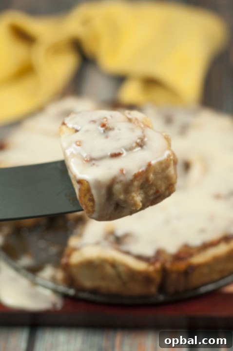 Beautifully arranged Carrot Cake Cinnamon Rolls with Mascarpone Frosting, freshly baked and ready to serve.