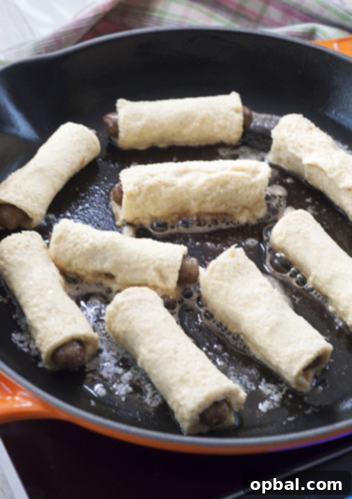 Sweet and Savory French Toast Sausage Rolls 5 Cooking the breakfast sausage in the cast iron skillet to brown the french toast batter.