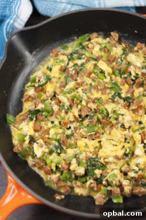 Savory Baked Breakfast Taquitos with Sausage Spinach and Egg 4 Rolling up the layers of the Baked Chicken Sausage, Spinach and Egg Breakfast Taquitos.