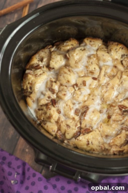 Overnight Cinnamon Bun French Toast Casserole 4 Crock Pot Cinnamon Bun French Toast with pecans. A perfect slow cooker recipe for holidays like Christmas, Easter, or Thanksgiving, offering effortless elegance.