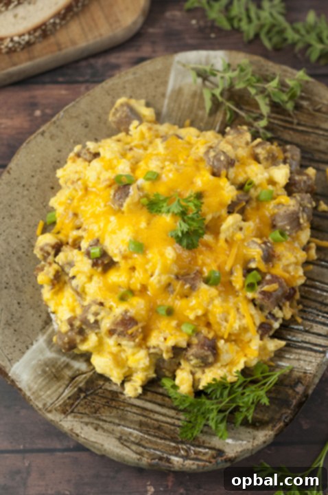 Cheesy Sausage Egg Morning Scramble 4 Pork Sausage, Egg, and Cheese Scramble recipe is a tasty combination of your favorite breakfast foods for a hearty weekday morning, "brinner", or Sunday morning family breakfast.