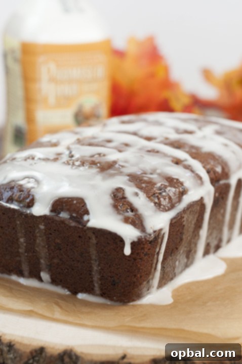 Whiskey Kissed Chocolate Chip Pumpkin Loaf 5 Bourban-Glazed Chocolate Chip Pumpkin Bread recipe where cinnamon and fall spices blend with chocolate holiday flavors to make the most tender, moist holiday quick bread for any occasion!