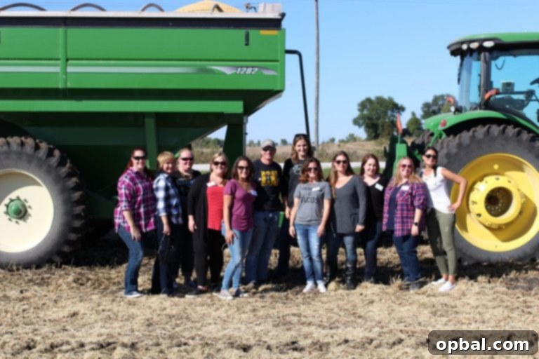 Grandma's Classic Creamed Corn Bake 10 A group photo taken at Kenney farm, standing proudly in front of a large combine harvester.