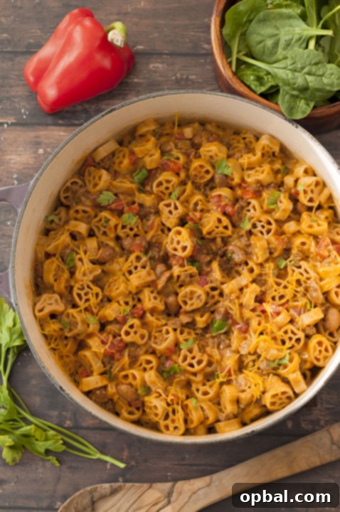 Ultimate Skillet Chili Mac 5 Close-up of a serving of One-Pot Chili Mac and Cheese, showcasing the creamy, cheesy pasta and rich chili sauce, ready to be enjoyed.