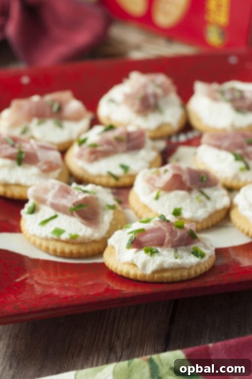 Elevate your holiday entertaining with these elegant Whipped Ricotta Prosciutto Cracker Bites, perfect for Christmas Eve, New Year's Eve, or any festive gathering. Simple to make, yet bursting with sophisticated flavor.