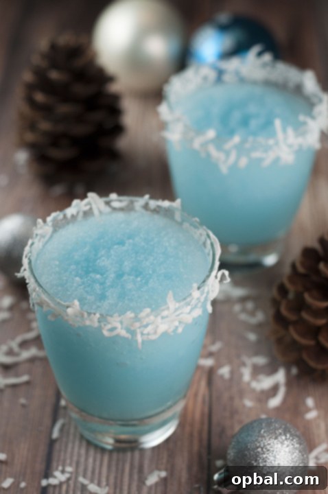 Arctic Blue Coconut Dream 4 A beautifully blended Blue Christmas Coconut Cocktail, showing its smooth texture, ready to be served from a blender.