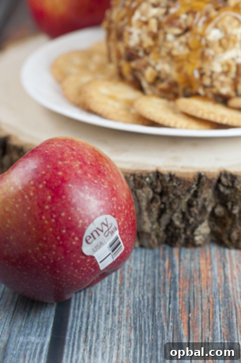 Caramel Apple Cheese Ball featuring fresh Envy apples, a versatile sweet and salty treat for holidays, snacks, or fall desserts.
