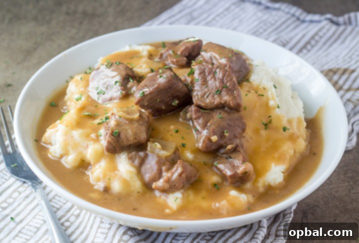 Succulent Slow Cooker Beef and Gravy 3 Crock Pot or Slow Cooker Beef Tips and Gravy is perfect to serve to dinner guests but simple enough for a weeknight supper recipe! Serve it over noodles, potatoes or rice!
