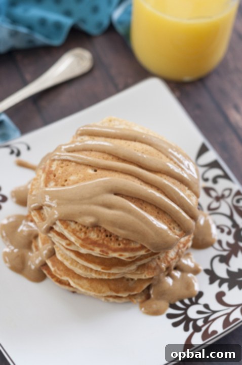 Delicious Old-Fashioned Peanut Butter Pancakes with warm sauce, a perfect sweet breakfast idea