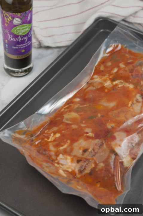 Wegmans Chicken Cacciatore oven-ready meal on the baking pan.