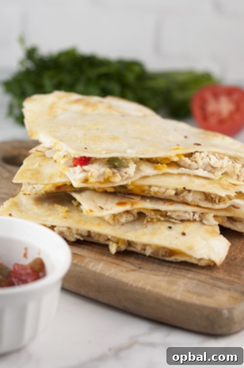 Cheesy Fajita Chicken Wraps 2 Chicken Fajita Quesadillas are the perfect weeknight meal recipe and great for Mexican food night! They're so easy to make right at home and you'll love this variation of the traditional quesadilla.