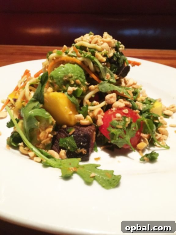 NYC Uncovered: Where to Dine and What to Experience 14 Thai Steak and Noodle Salad at Hillstone restaurant, Manhattan, NYC, a vibrant and delicious dish.