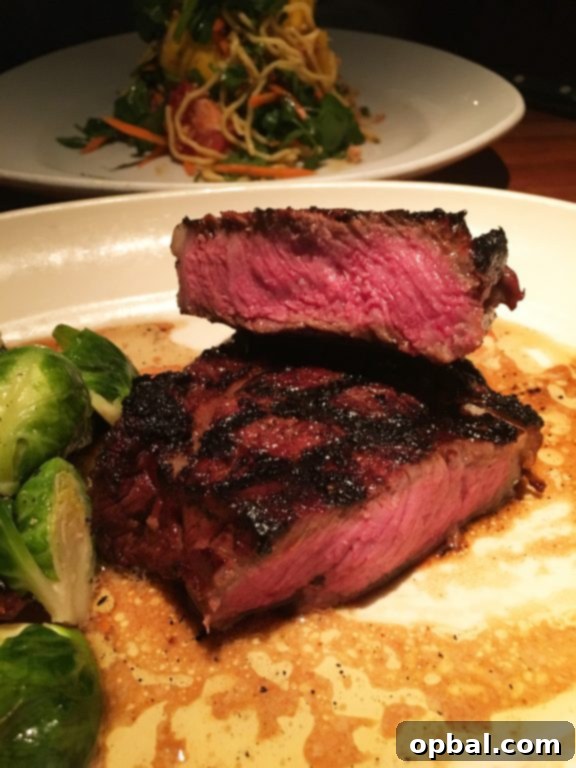 NYC Uncovered: Where to Dine and What to Experience 15 Ribeye Steak at Hillstone or Houston's Restaurant in New York City, perfectly cooked and flavorful.
