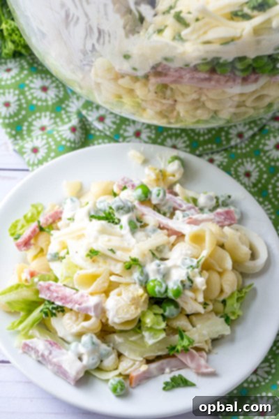 Stunning Eight-Layer Prep-Ahead Salad 8 Make-Ahead Eight Layer Salad with pasta, ham, salami, and a creamy dressing.