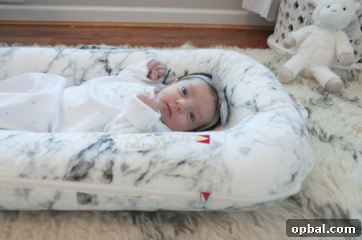 DockATot A Lifesaver for New Moms 2 DockATot Deluxe+ Carrara Marble Sleeper and Lounger Review for New Moms