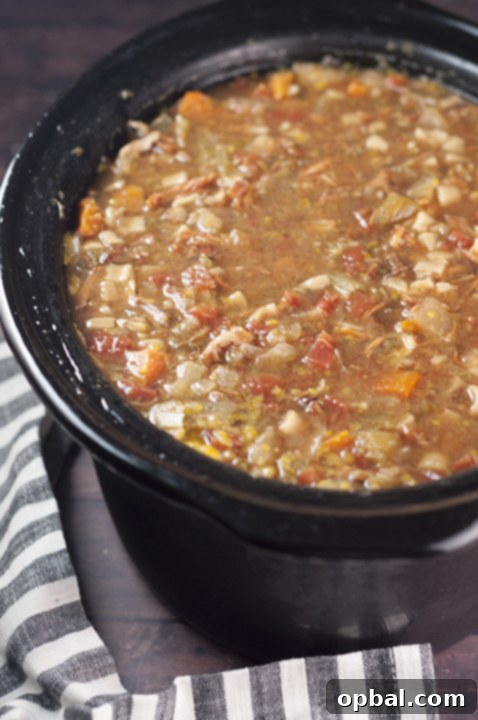 Rustic Slow Cooker Sicilian Chicken Soup 3 A close-up view of the ingredients for Slow Cooker Sicilian Chicken Soup, including fresh carrots, celery, potatoes, onions, and diced tomatoes, ready to be slow-cooked to perfection.