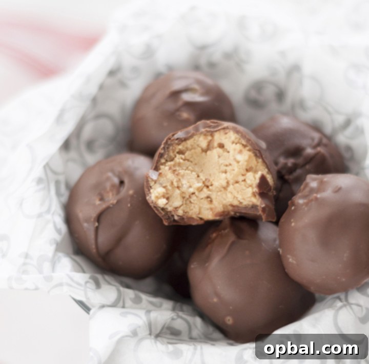 Easy Peanut Butter Krispie Bites 5 Finished No-Bake Peanut Butter Rice Krispie Balls on a serving platter, showcasing their festive appeal.