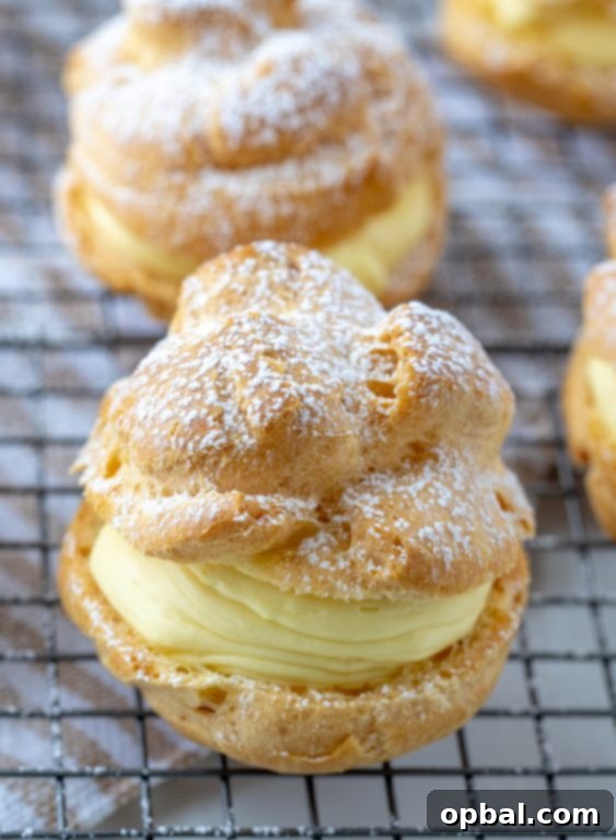 Cloud-Like Cream Puffs from Your Kitchen 3 Homemade Cream Puffs with vanilla pudding cream filling, perfect for any special occasion or holiday dessert.
