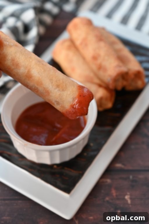 Golden-Baked Pepperoni Pizza Poppers 2 Crowd-Pleasing Baked Pepperoni Pizza Rolls recipe using egg roll wrappers, a healthier version of store-bought pizza logs. These rolls are baked, not fried!