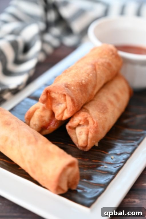 Golden-Baked Pepperoni Pizza Poppers 3 Crowd-Pleasing Baked Pepperoni Pizza Rolls recipe using egg roll wrappers, a healthier take on restaurant-style pizza logs. These rolls are baked, not fried!