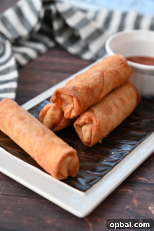 Golden-Baked Pepperoni Pizza Poppers 5 Easy Crowd-Pleasing Baked Pepperoni Pizza Rolls appetizer recipe using egg roll wrappers, a healthier alternative to fried pizza logs from diners. These rolls are baked, not fried!