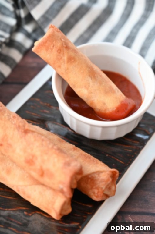 Golden-Baked Pepperoni Pizza Poppers 6 Crowd-Pleasing Baked Pepperoni Pizza Rolls recipe using egg roll wrappers, an ideal healthier appetizer, baked instead of fried like diner pizza logs.
