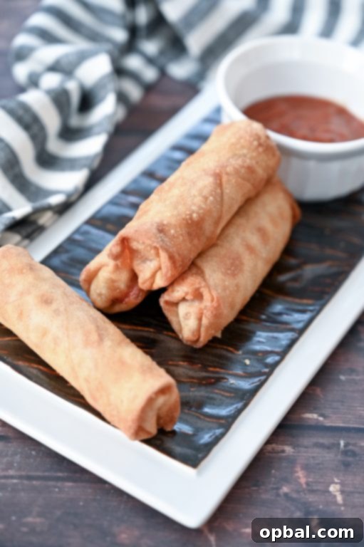 Golden-Baked Pepperoni Pizza Poppers 7 Easy Crowd-Pleasing Baked Pepperoni Pizza Rolls appetizer recipe using egg roll wrappers, a healthier version of pizza logs from diners. These pizza logs are baked, not fried!