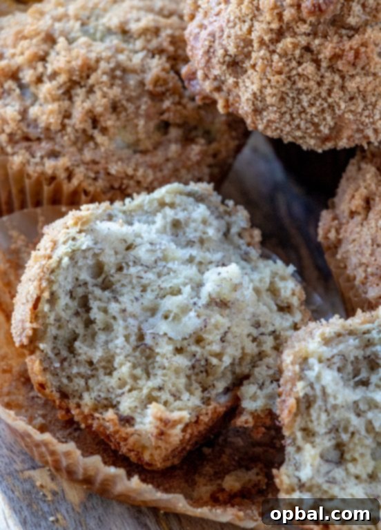 A delectable view of an easy banana crumb muffin, highlighting the golden-brown exterior and crumbly streusel.