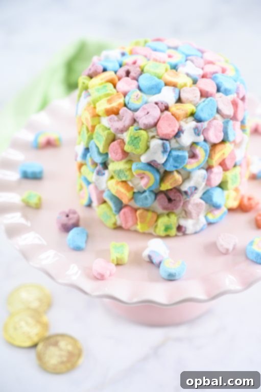 Magical Marshmallow Layer Cake 3 Easy Lucky Charms Layer Cake decorated with rainbow marshmallows, perfect for a festive occasion