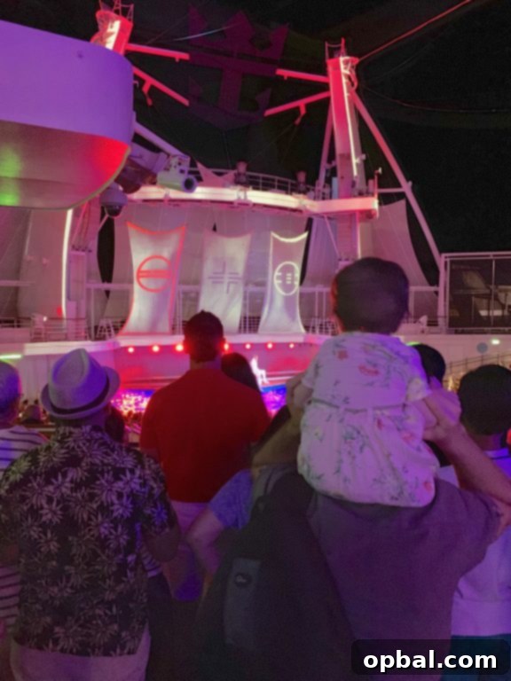 Baby on Board Your Guide to a Family Cruise 14 Watching the aqua show on board Royal Caribbean Symphony of the Seas cruise.