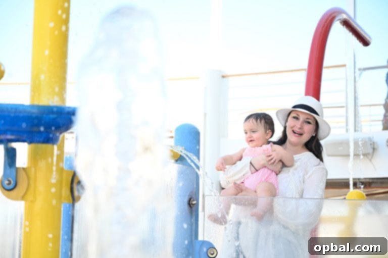 Baby on Board Your Guide to a Family Cruise 17 Swimming in the baby Splash zone pool on board Royal Caribbean Symphony of the Seas Caribbean cruise.