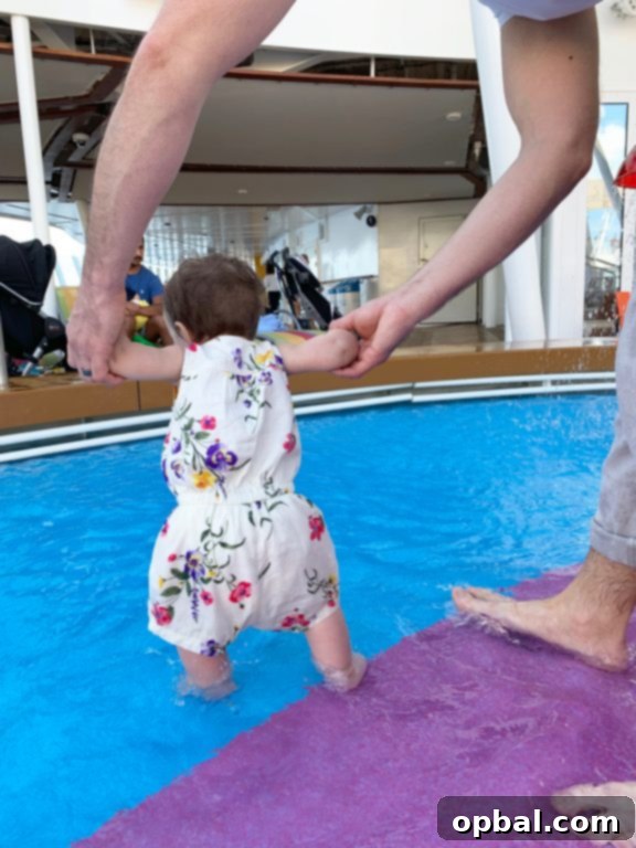 Baby on Board Your Guide to a Family Cruise 23 Splashing around in the baby pool during Royal Caribbean Symphony of the Seas Caribbean cruise.