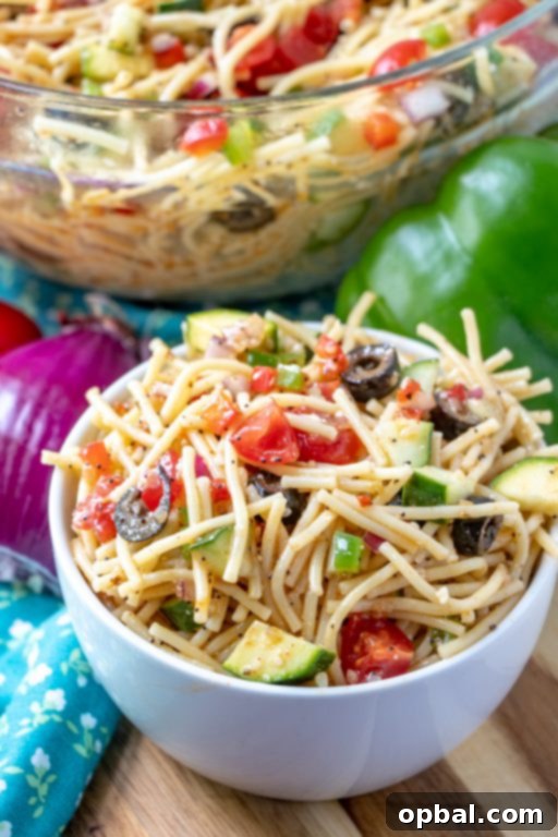 Golden State Spaghetti Medley 3 California Spaghetti Salad featuring fresh zucchini and other vibrant vegetables, ideal for summer gatherings.