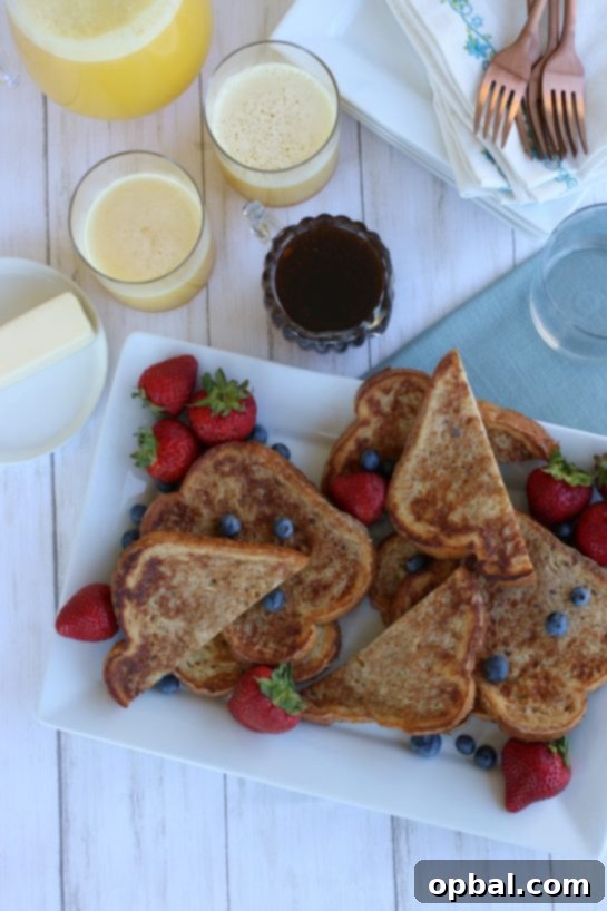 Perfect French Toast Recipe 13 Overhead view of french toast with strawberries and blueberries.