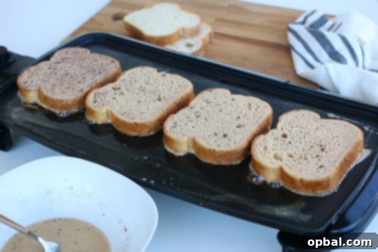 Perfect French Toast Recipe 4 Cooking French Toast on a kitchen griddle.