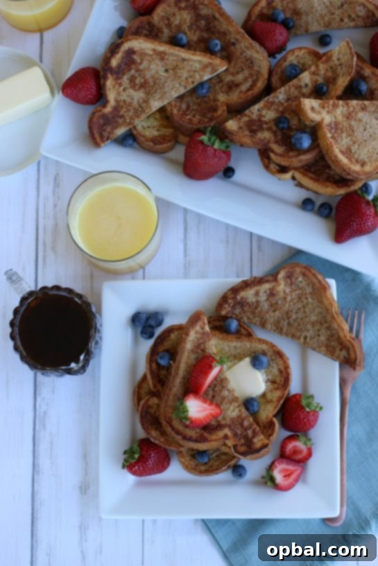 Perfect French Toast Recipe 10 Overhead view of french toast with fruit- strawberries and blueberries.
