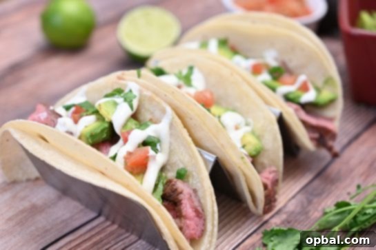 Sizzling Flank Steak Tacos with Cool Avocado and Bright Cilantro Lime Crema 7 Enjoying tender, juicy grilled flank steak tacos with creamy avocado and refreshing cilantro lime crema on a sunny day.