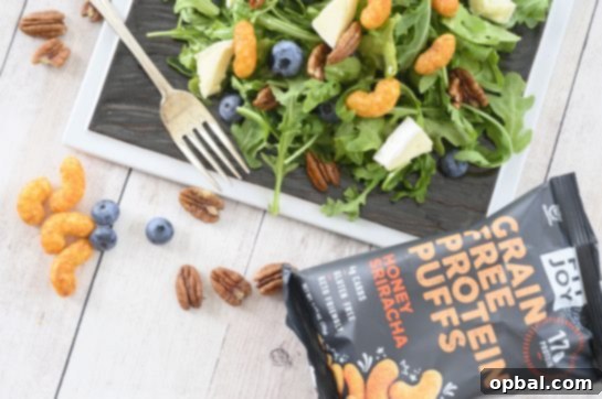 Blueberry Brie Pecan Salad with Crispy Protein Puffs 4 Blueberry-Brie Pecan Salad featuring crispy FitJoy Protein Puff Croutons for a healthy, flavorful meal.
