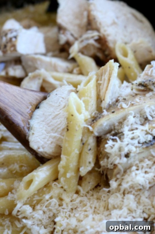 Slow Cooker Creamy Chicken Alfredo 2 Close up view of crock pot chicken alfredo that was cooked in a slow cooker.