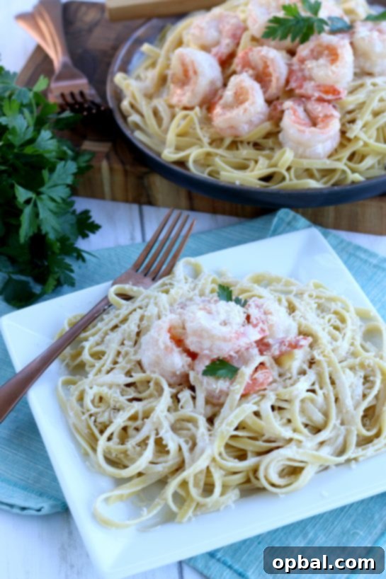 A generous serving of creamy garlic butter shrimp, perfectly coated in sauce and sprinkled with fresh herbs, presented on a plate, highlighting its readiness for a delicious dinner.