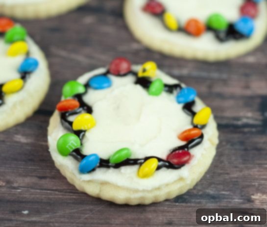 Twinkling Christmas Light Cookies 3 Easy Christmas Light Bulb Cookies recipe use simple buttercream frosting and mini M&Ms, making them perfect for kids and avoiding the fuss of royal icing.
