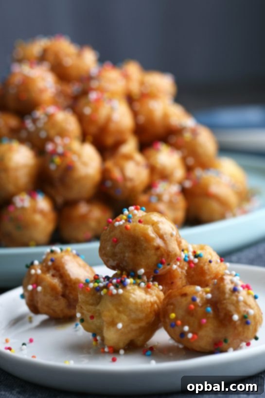 Golden Struffoli: Italian Honey Delights 11 A close up shot of a serving of the struffoli on a plate ready to eat.